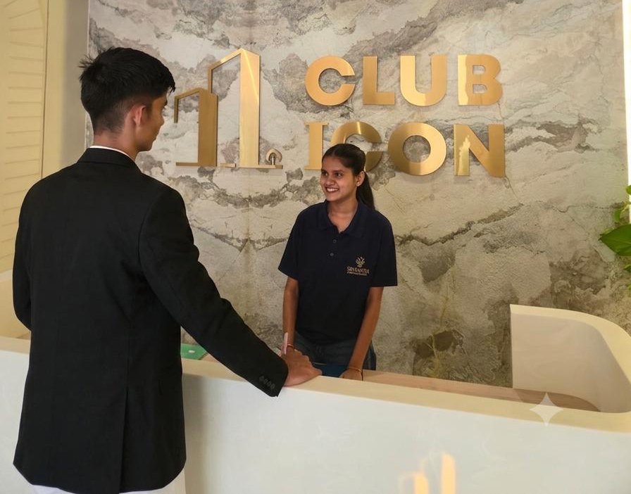 Sevaantha front-office professional welcoming a visitor.